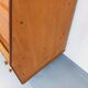 Vintage wooden display bookshelf with drawers from the 1960s.
