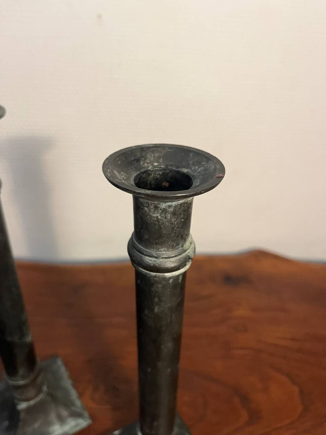 Pair of removable patinated brass candlesticks