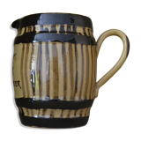 Striped pitcher and inscription