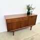 Teak Jentique sideboard — 1 door, 2 drawers & drop-down bar, England 1950s-60s