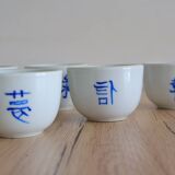 Teapot set and 9 cups with Chinese and French words