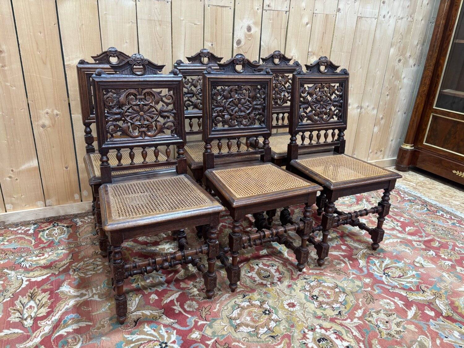 6 High Era chairs in carved solid oak and rattan caning.