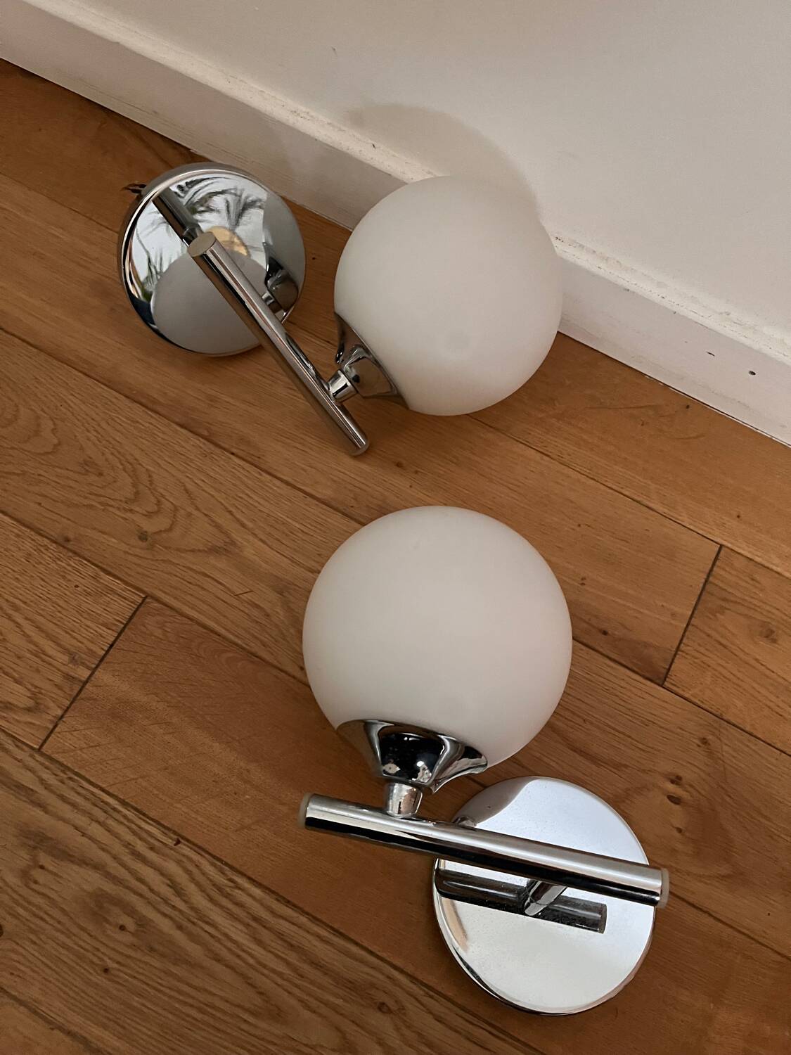 Pair of metal and opaline wall lights