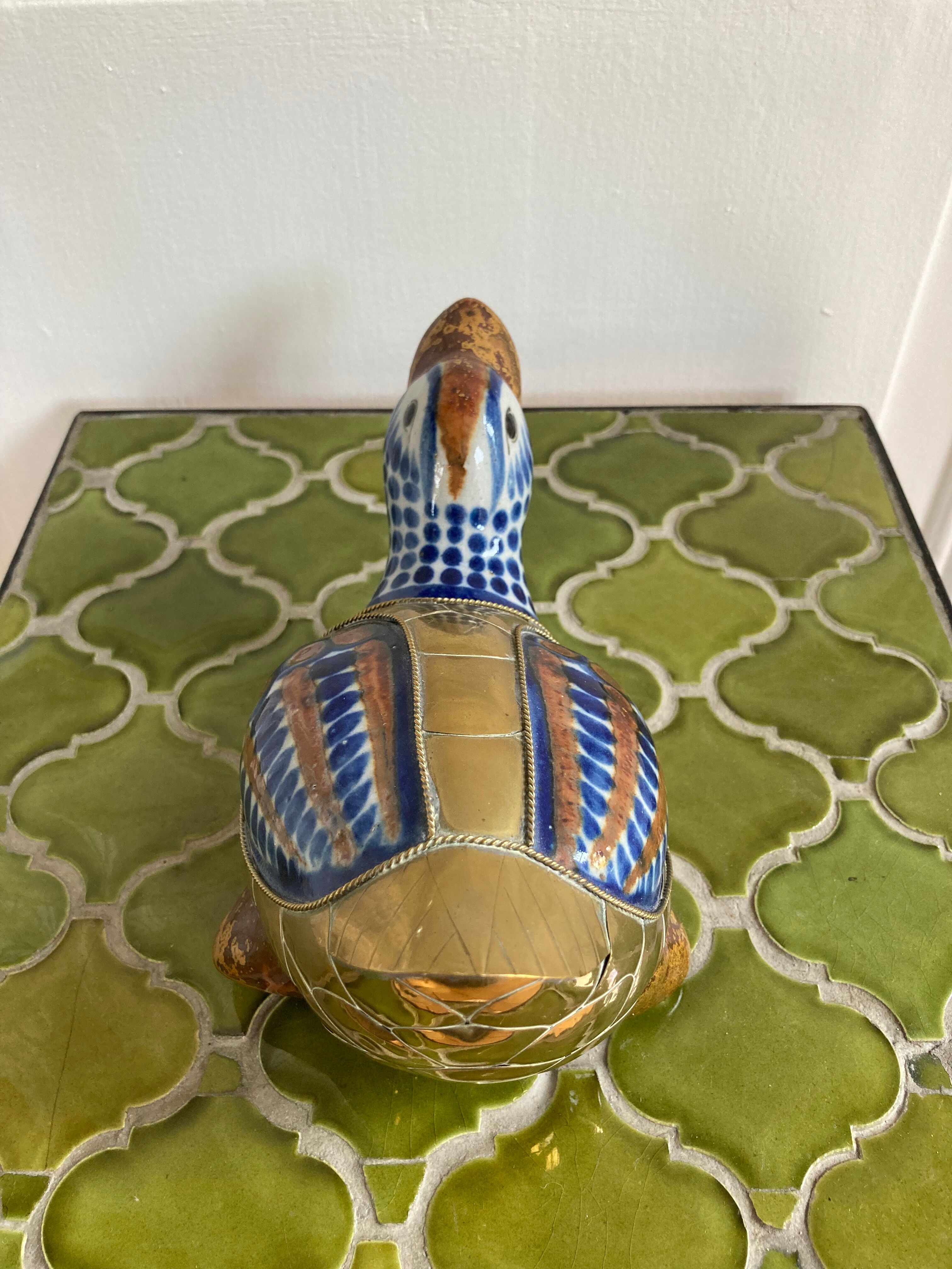 Brass duck and ceramic