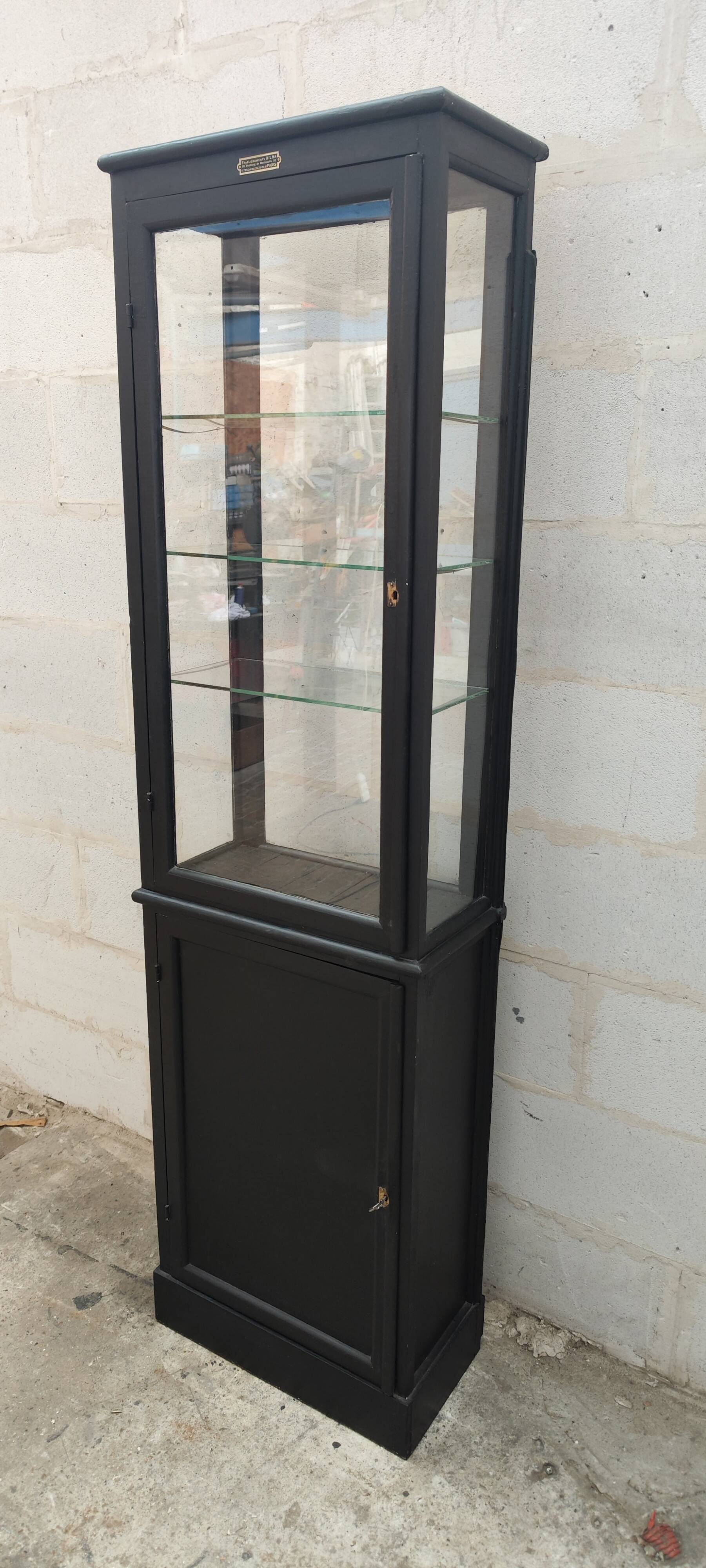 Old two-door shop showcase with black patina