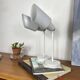Pair of old industrial adjustable wall sconces in white metal.