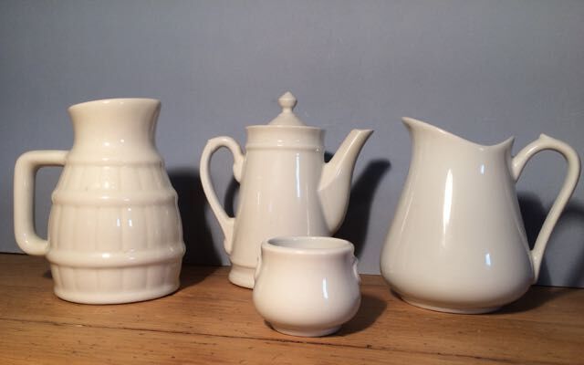 Trio of pitchers and jam jar