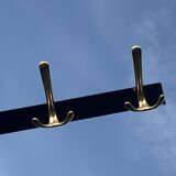 Vintage coat rack in lacquered metal with three golden aluminum hooks