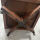 Rotating library in solid walnut, 20th century.