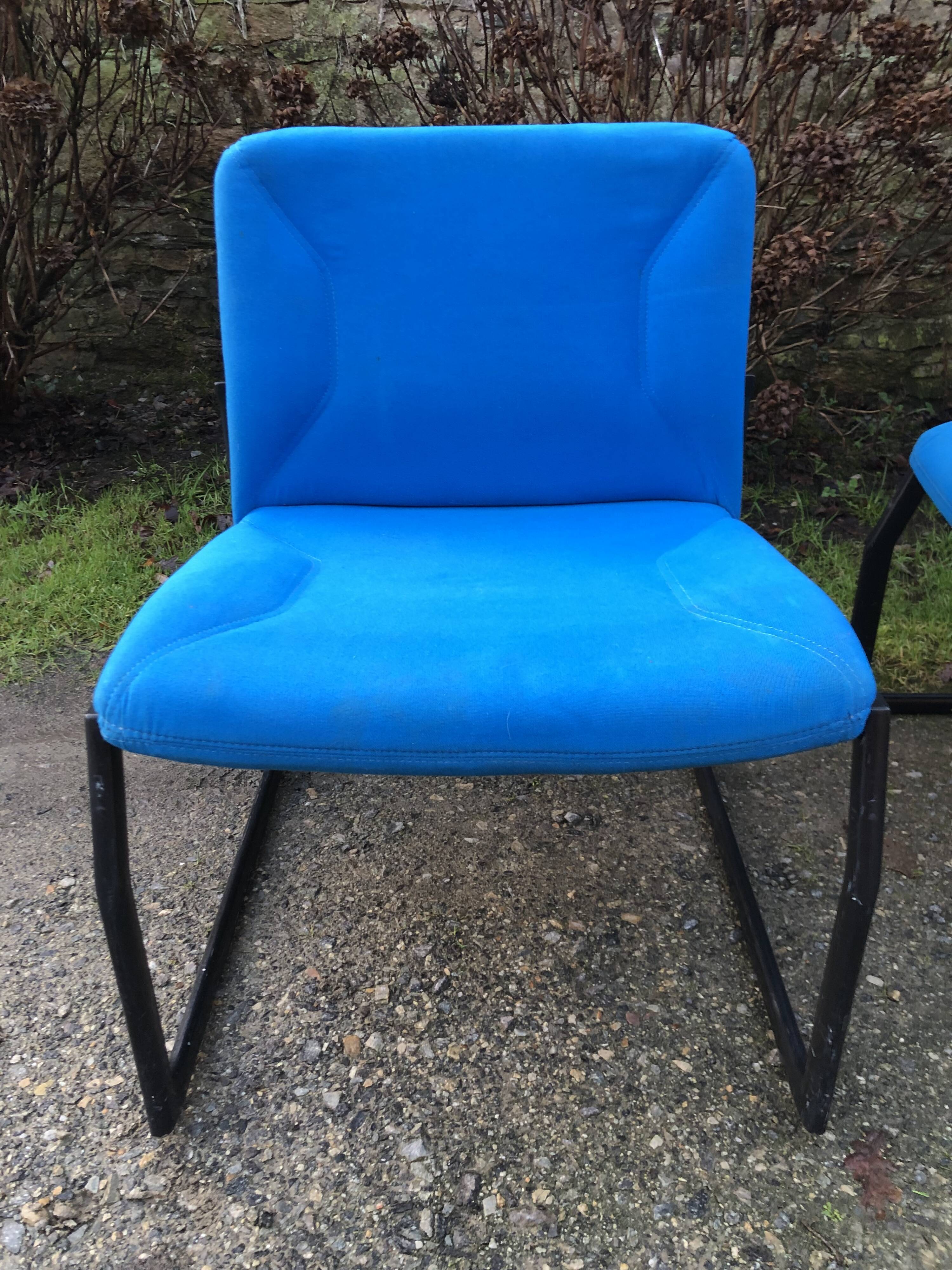 Electric blue fabric designer armchairs with black lacquered metal legs from the 80s.