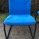 Electric blue fabric designer armchairs with black lacquered metal legs from the 80s.