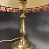 Desk lamp with brass base and lampshade with trimmings