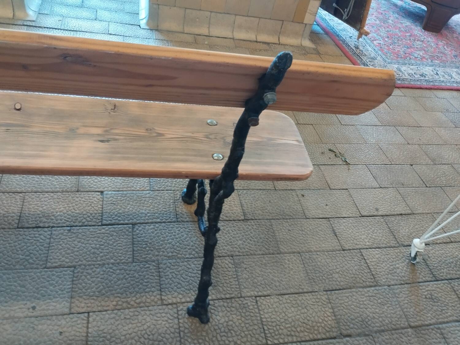 Antique garden bench with cast iron legs