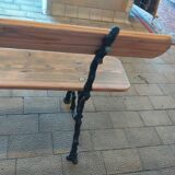Antique garden bench with cast iron legs