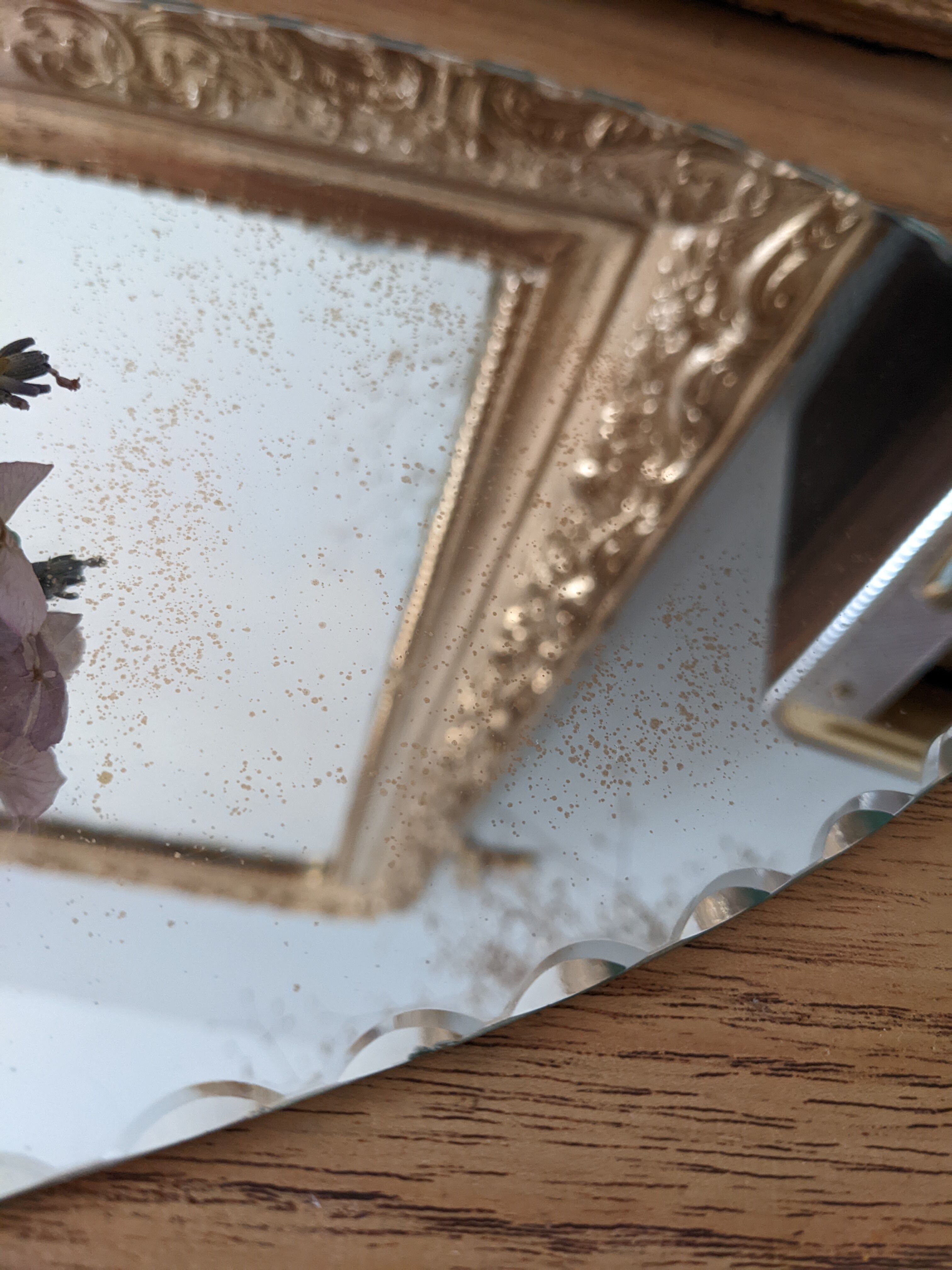 Vintage chiseled bevelled mirror under oval velvet