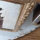 Vintage chiseled bevelled mirror under oval velvet