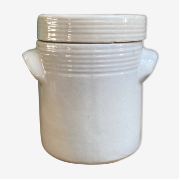 White pot in glazed earth