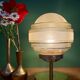 Vintage globe table lamp in frosted yellow and gold glass.