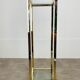 Gilded metal fifth wheel column and Hollywood Regency style glass 70s