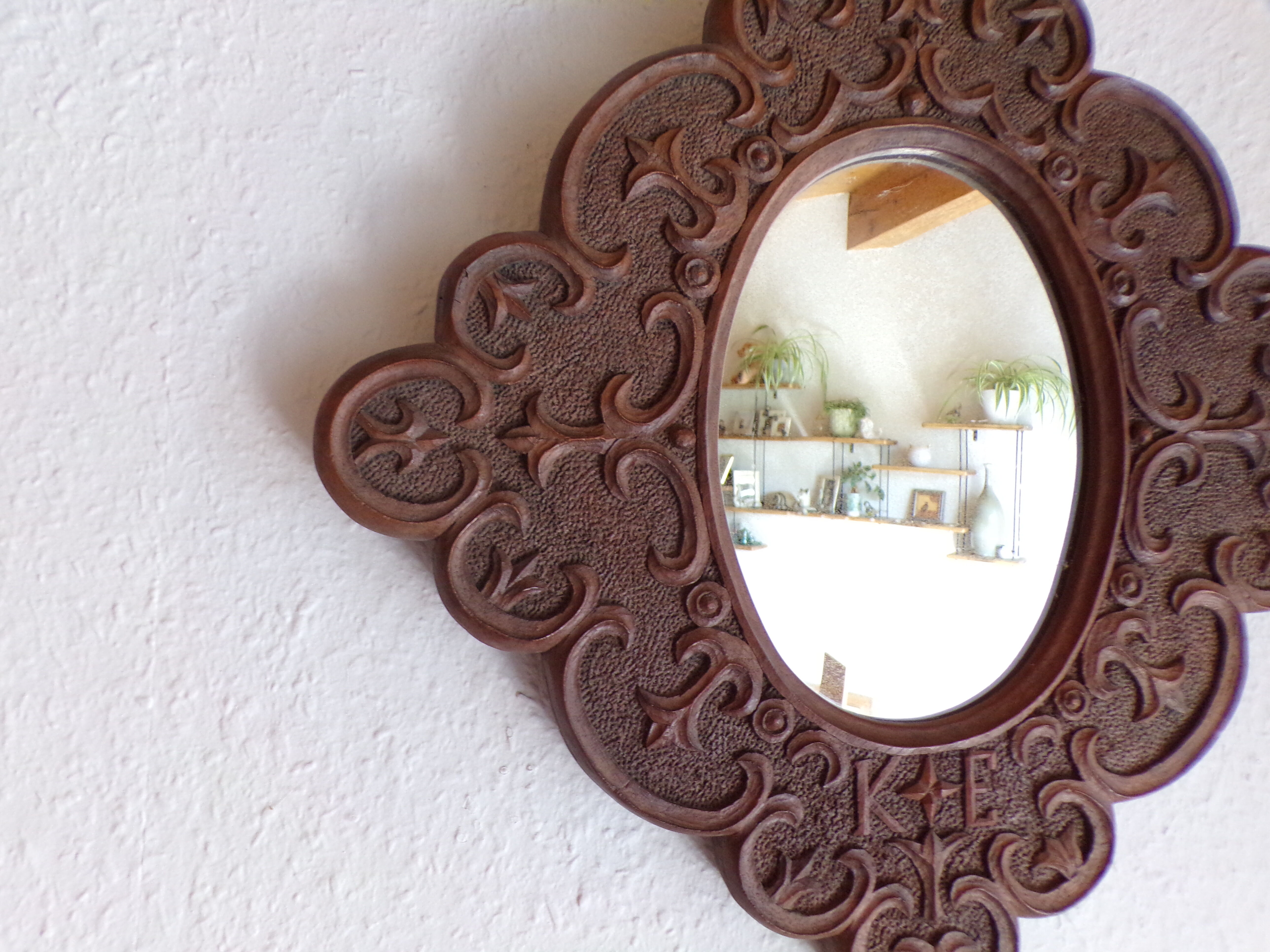 Carved wooden mirror and dated 1924
