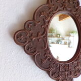 Miroir en bois sculpté et daté 1924