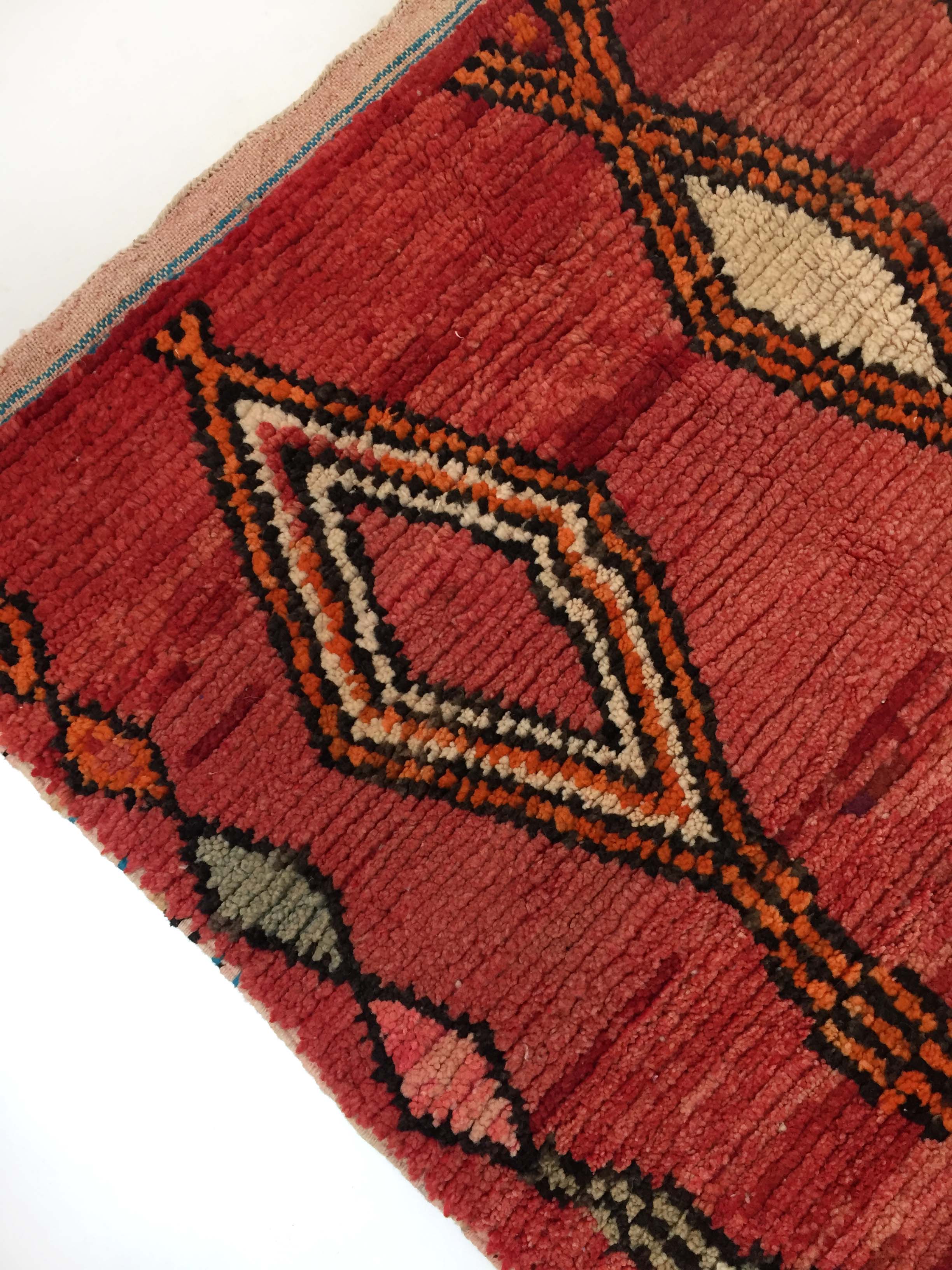 Moroccan Berber carpet Boujaad red with colorful patterns 252x158cm