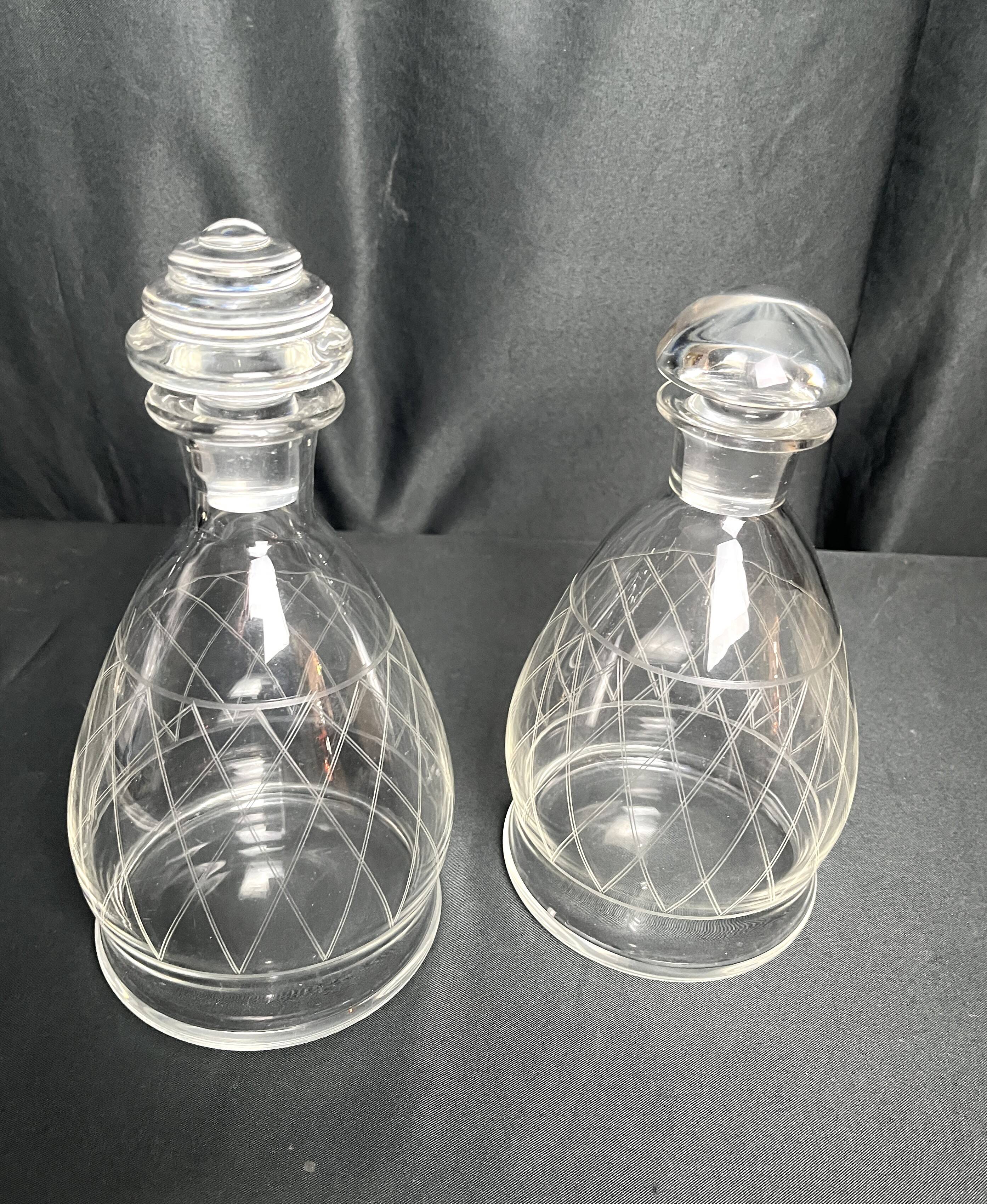Tableware, two engraved crystal carafes with stoppers from around 1940.