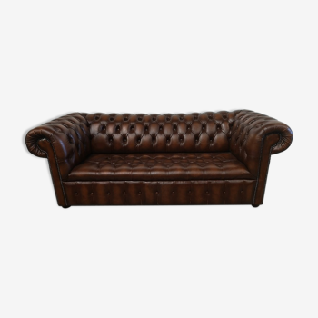 Light brown leather chesterfield sofa upholstered