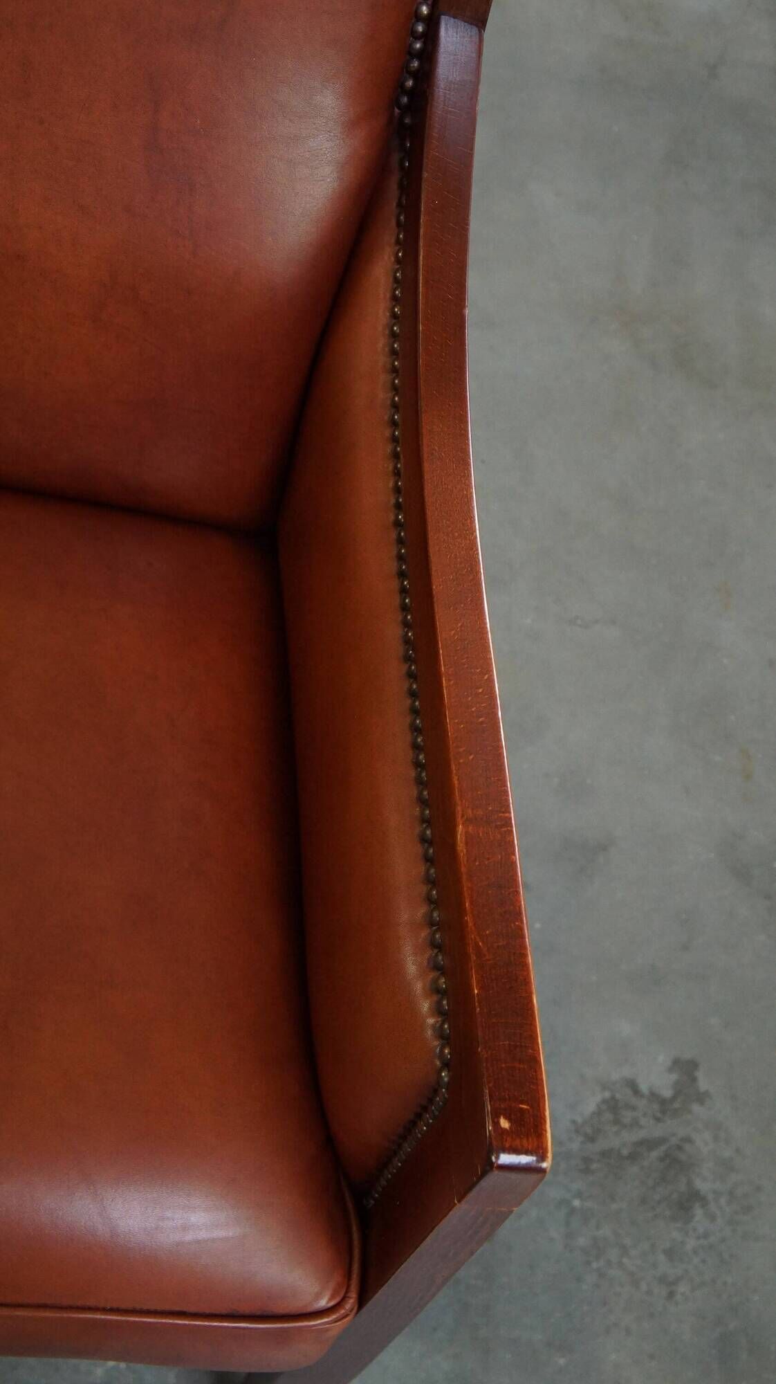 Majestic, luxurious set of 2 cognac-colored cowhide leather Art Deco design armchairs