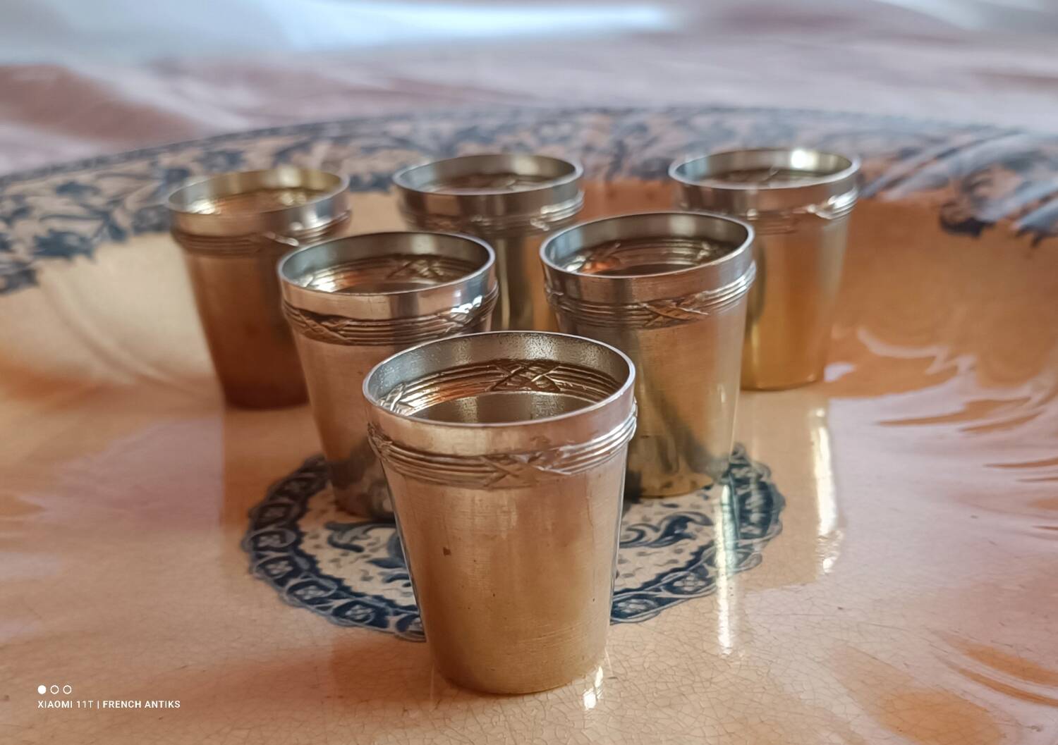 6 silver-plated metal glasses, decorated with a chased ribbon design