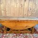 English gateleg coffee table in solid fir from the early 20th century.
