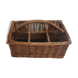 Basket carries glasses or cutlery in wicker.