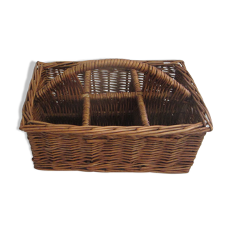 Basket carries glasses or cutlery in wicker.