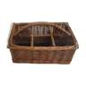 Basket carries glasses or cutlery in wicker.