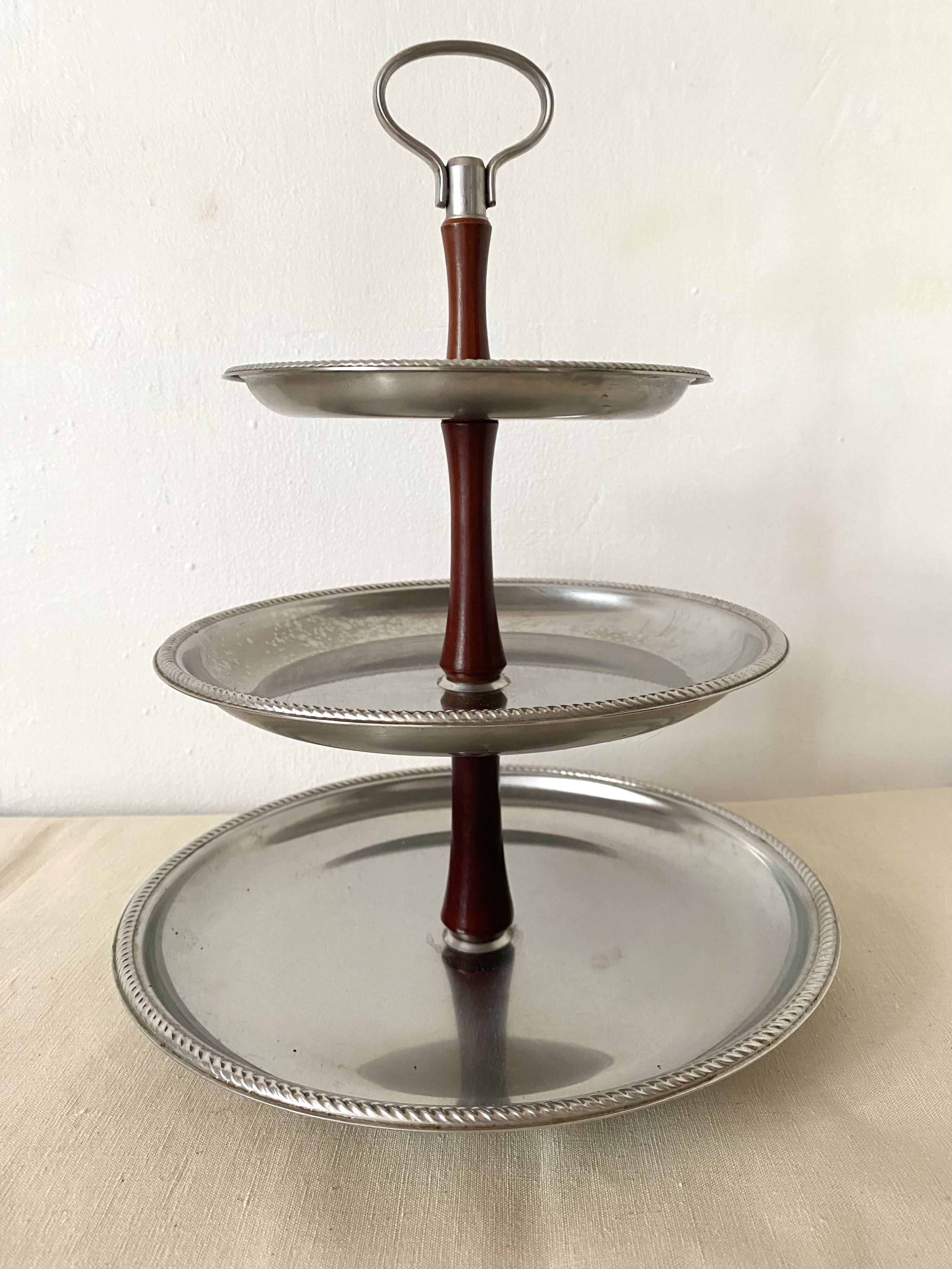 Vintage tiered display stand, stainless steel rotating server Alessi Fratelli