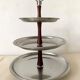 Vintage tiered display stand, stainless steel rotating server Alessi Fratelli