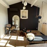 Black armchair with cane and natural rattan
