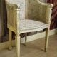 Gondola armchair in Louis XVI style, carved wood with a cream patina.
