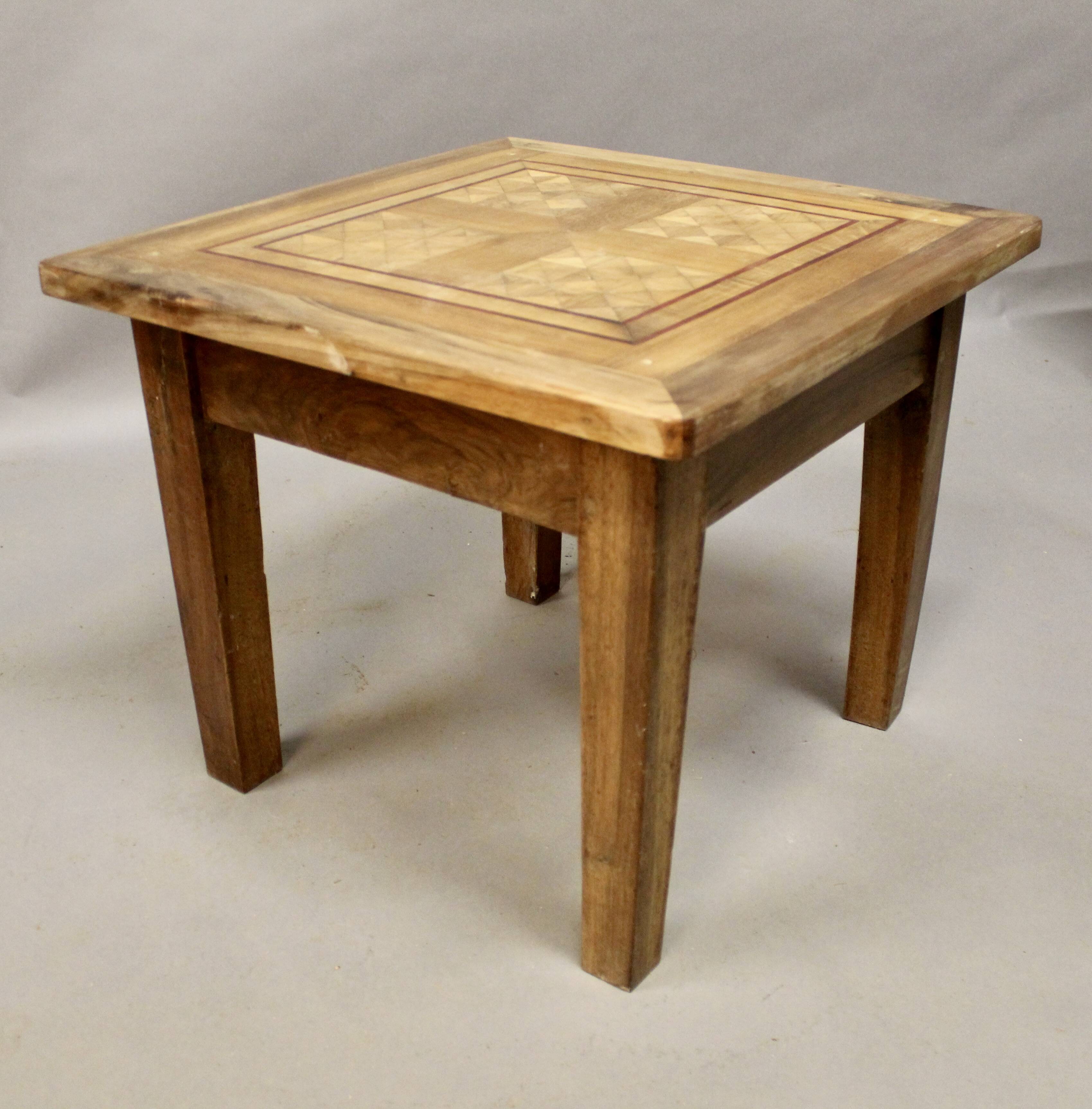 Coffee table on old parquet floor with marquetry