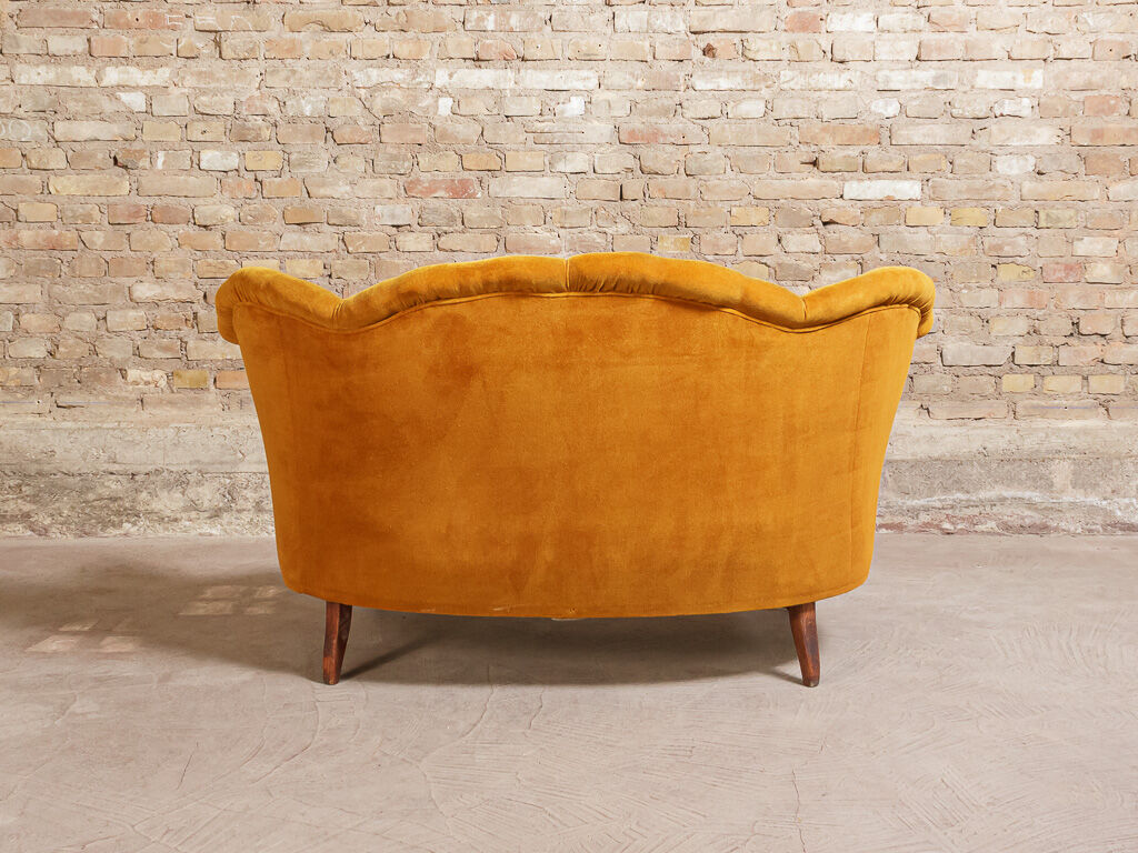 Yellow velvet padded toad sofa and wooden feet