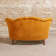 Yellow velvet padded toad sofa and wooden feet
