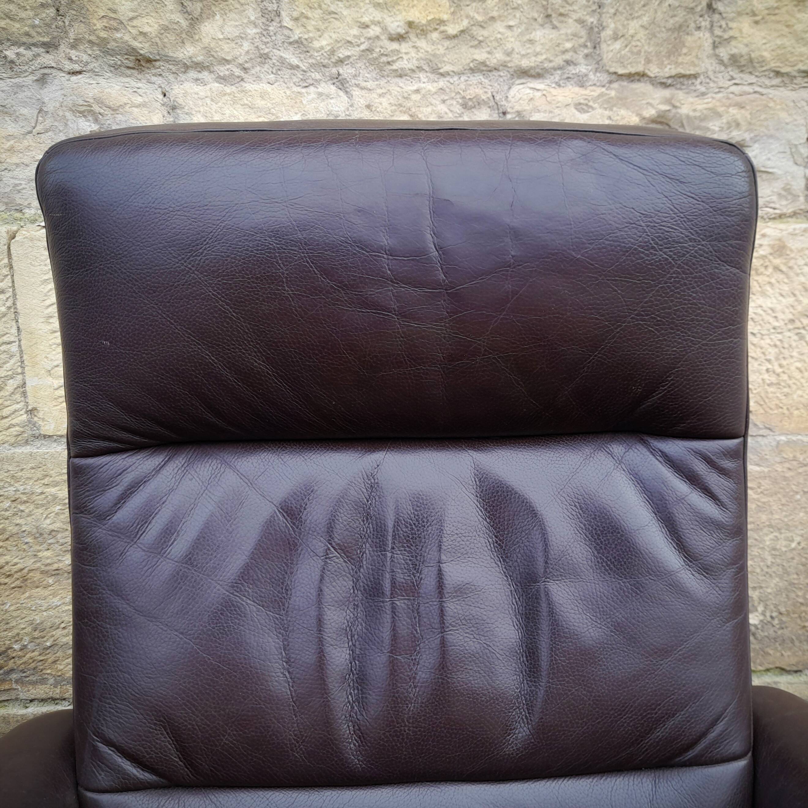 Pair of Scandinavian leather armchairs and ottoman, Ekornes, Norway, 1970s