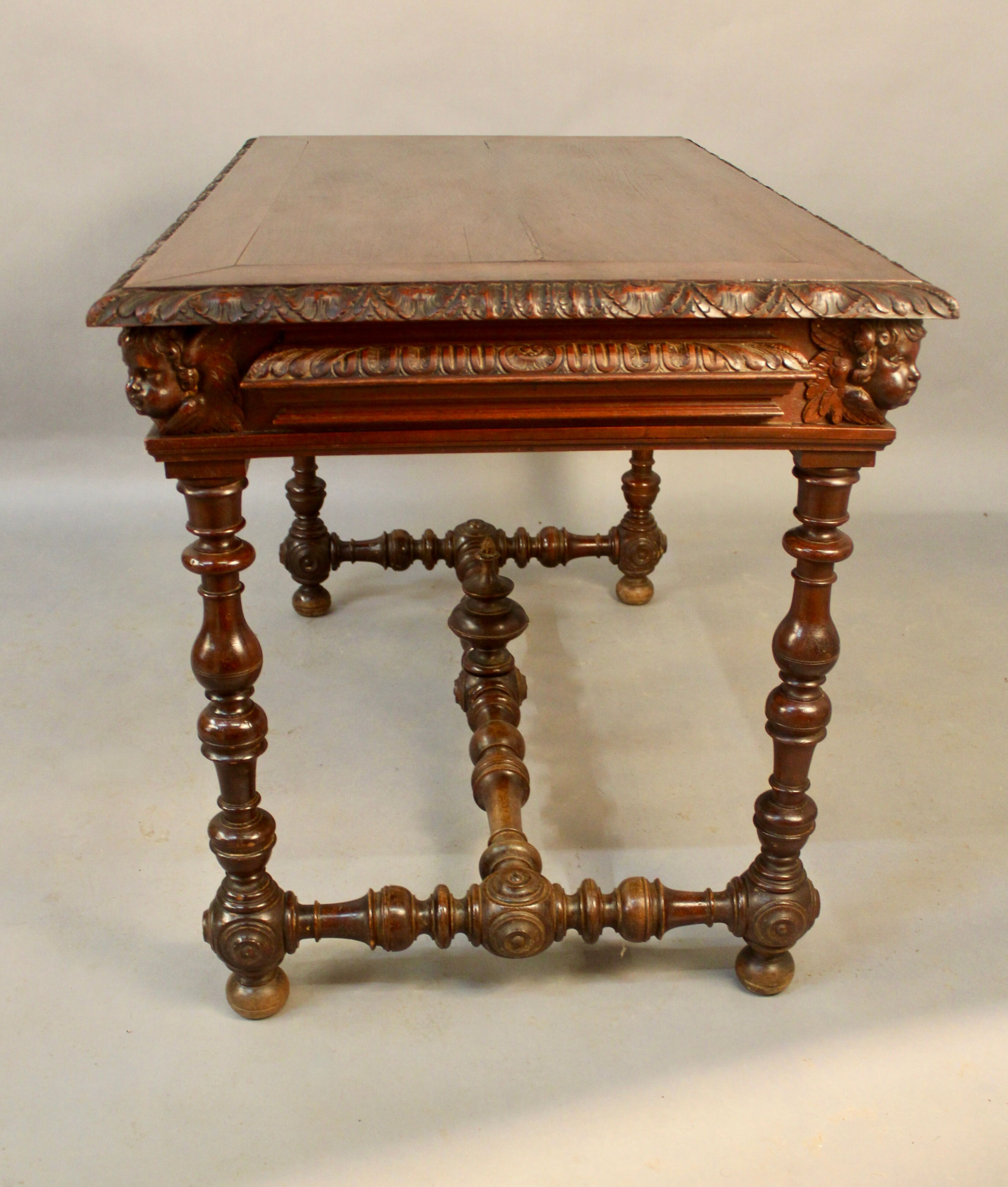 Louis XIII style writing table with Putti decoration