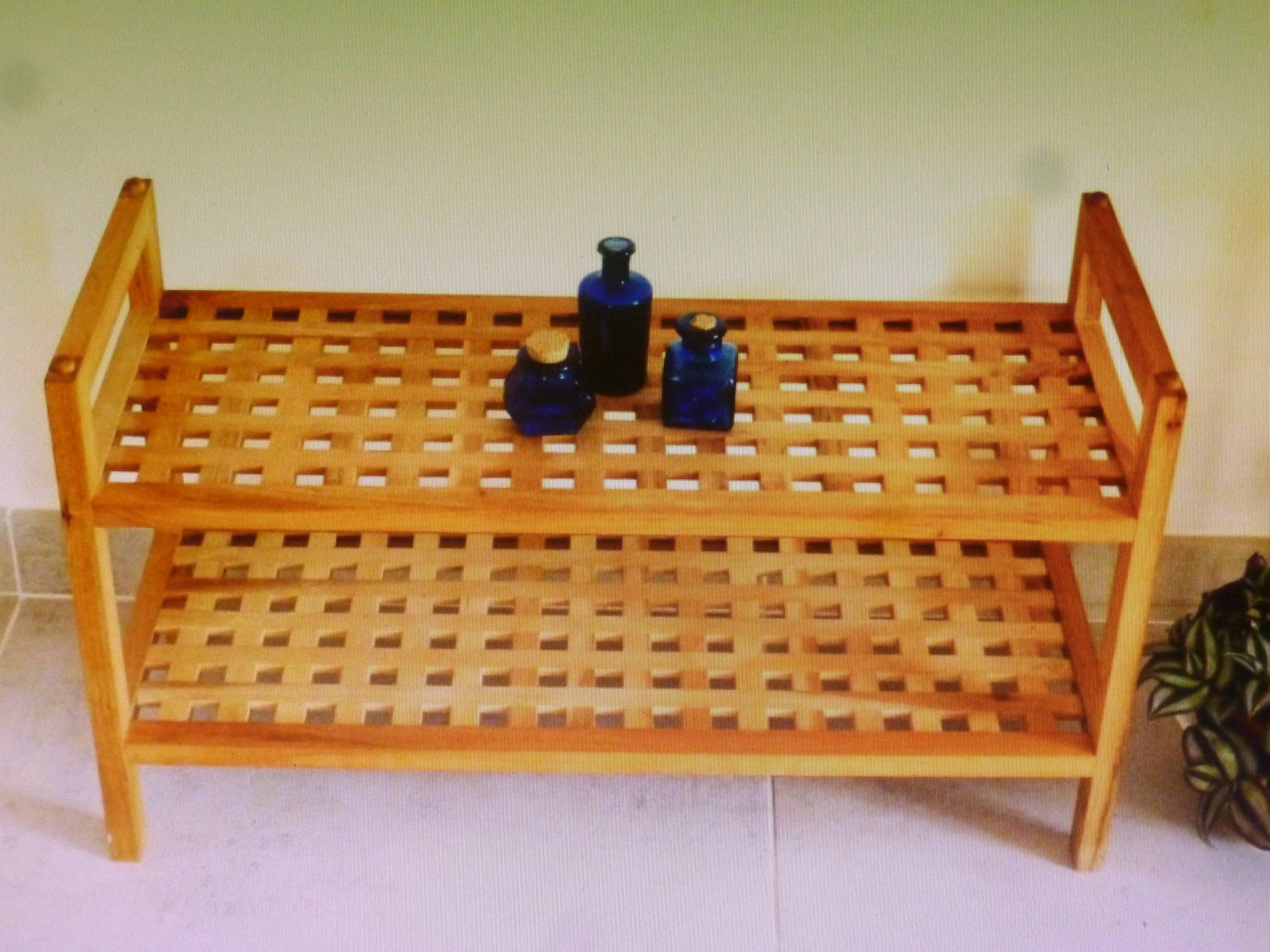 Wooden coffee table with openwork shelves and garden plant holder.