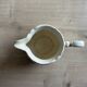 Old cream jug "Nous deux" in Sarreguemines earthenware.