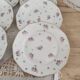 Lot de 12 assiettes à dessert en porcelaine Lourioux Foëcy France décor floral et doré