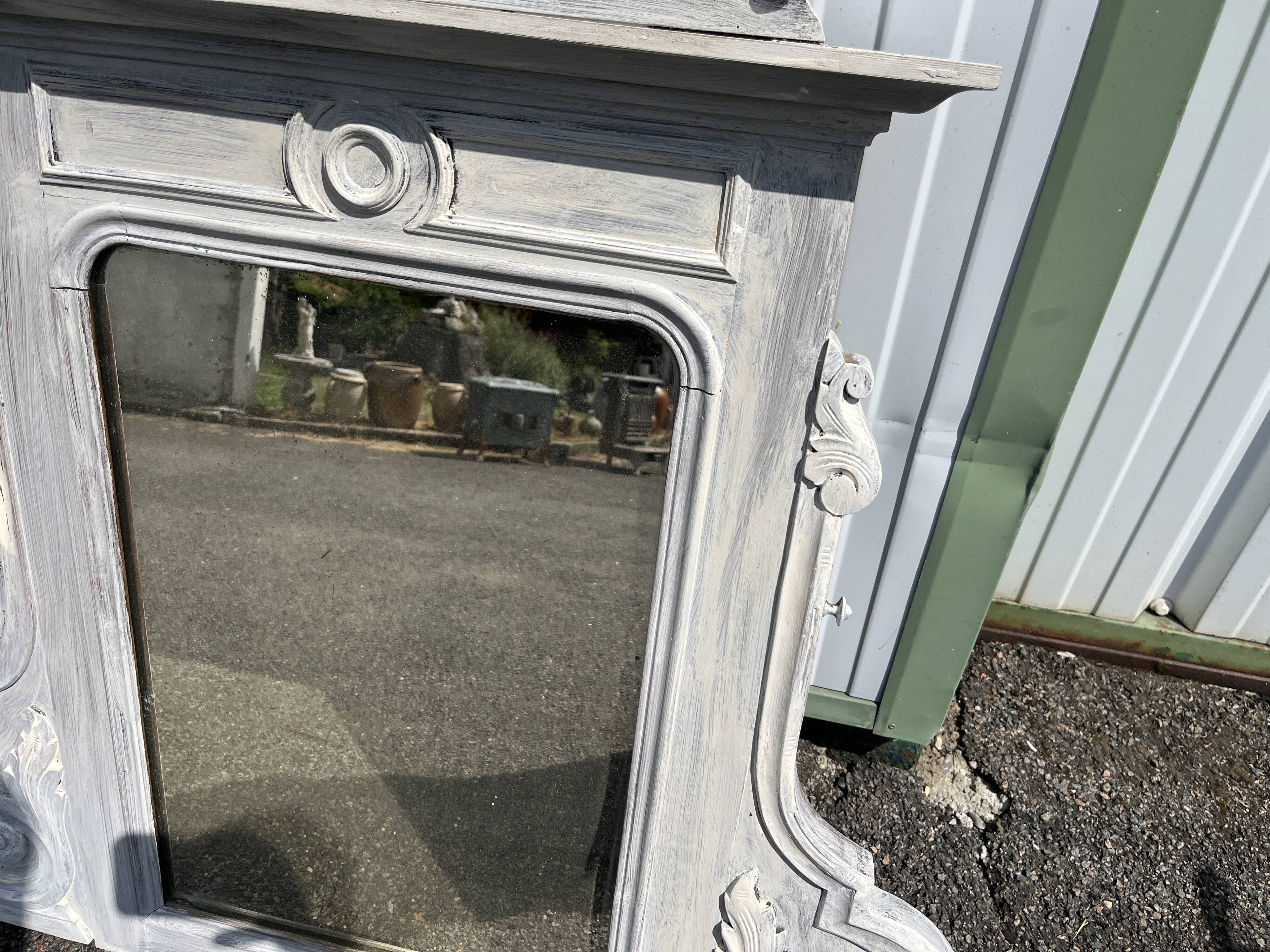 Large decorative mirror in carved wood with shabby patina