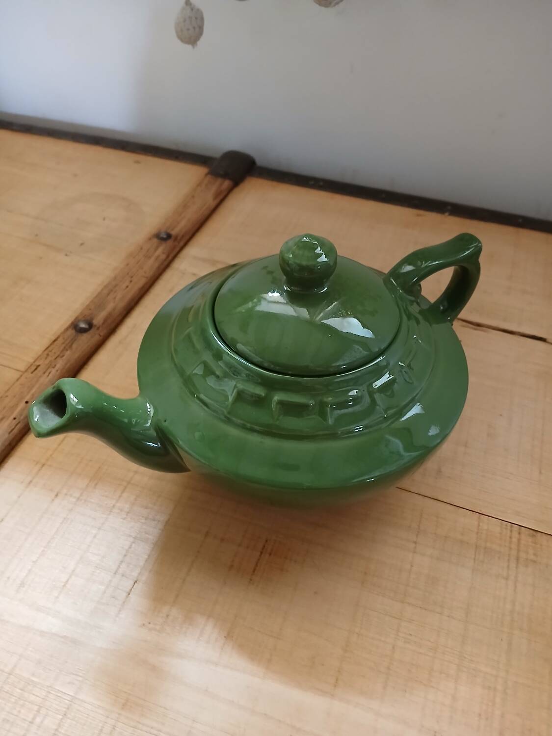 Green earthenware teapot
