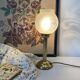 Lampe rétro pied colonne globe en verre