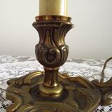 Vintage French bronze Wee Willie Winkie style lamp with red card shade.